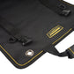 Black tool kit pouch corner with metal grommet, snap tab straps, and yellow trim logo patch