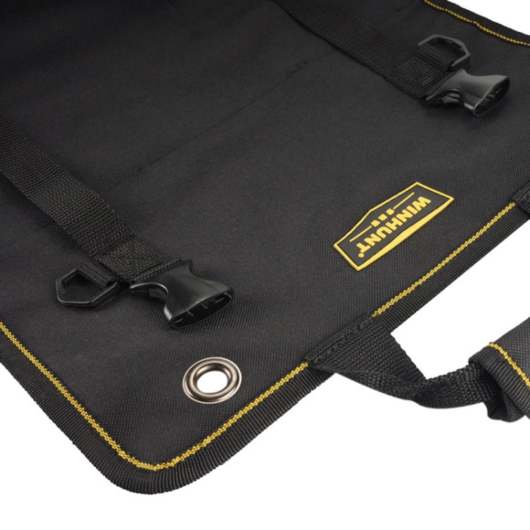 Black tool kit pouch corner with metal grommet, snap tab straps, and yellow trim logo patch