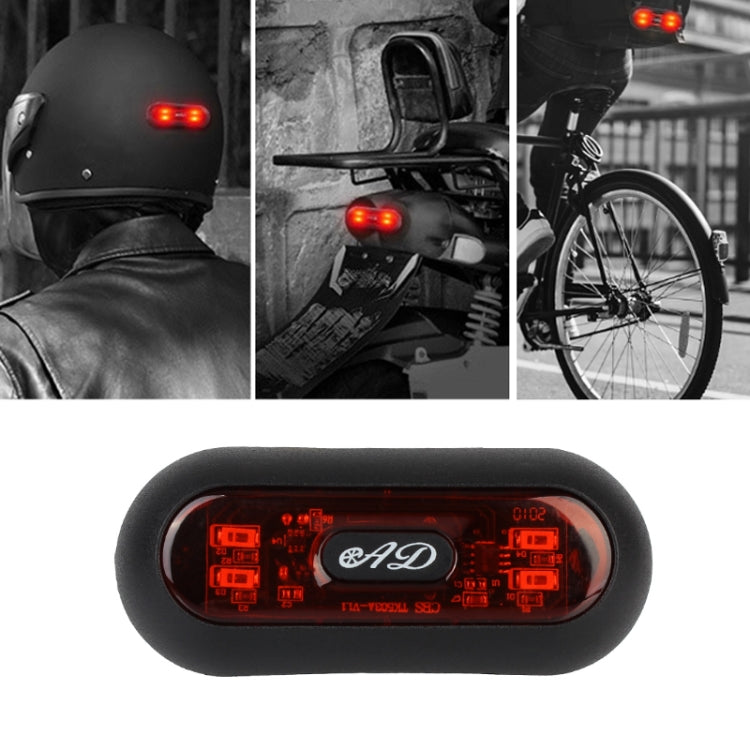 Motorbike helmet tail light with red warning LEDs, mounted on helmet back.