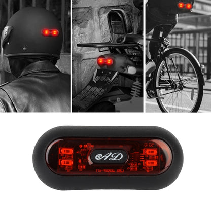 Motorbike helmet tail light with red warning LEDs, mounted on helmet back.