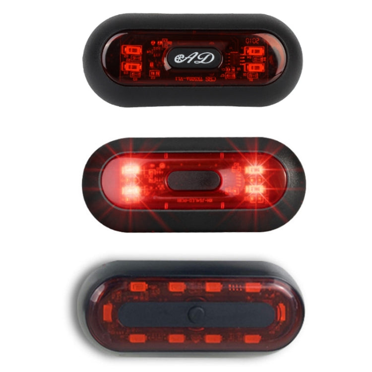Motorbike helmet tail light product view, black casing with red LED panel.