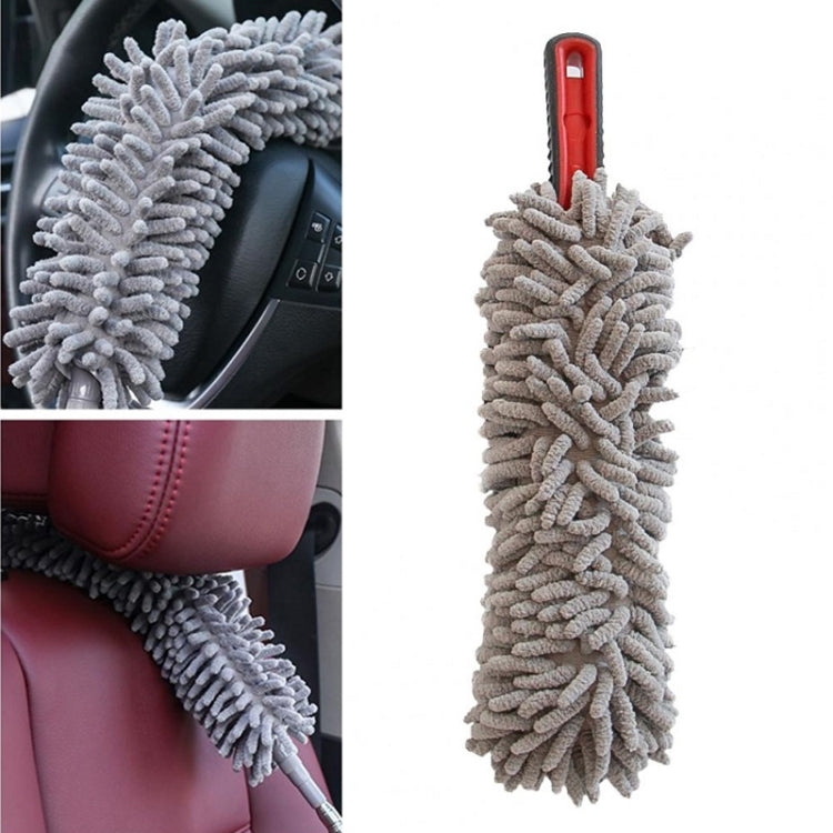 Gray chenille car wash duster with red handle, shown cleaning car interior