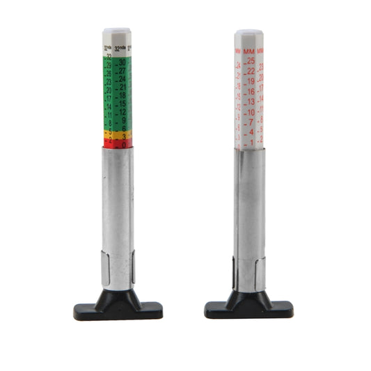 Pair of tire tread depth gauges with black bases and vertical scales, silver metal bodies