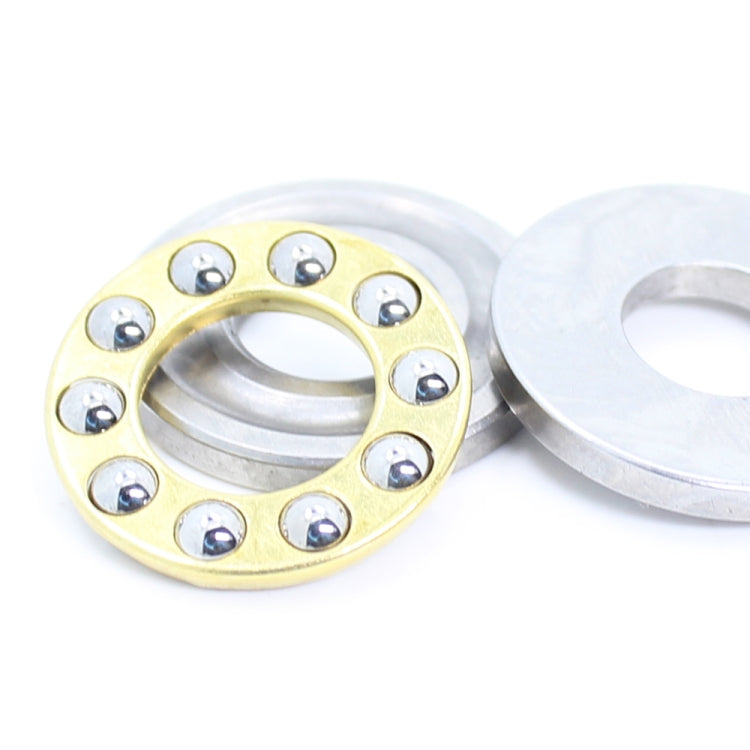 Thrust ball bearing with gold circular ring and silver washer, two-piece view