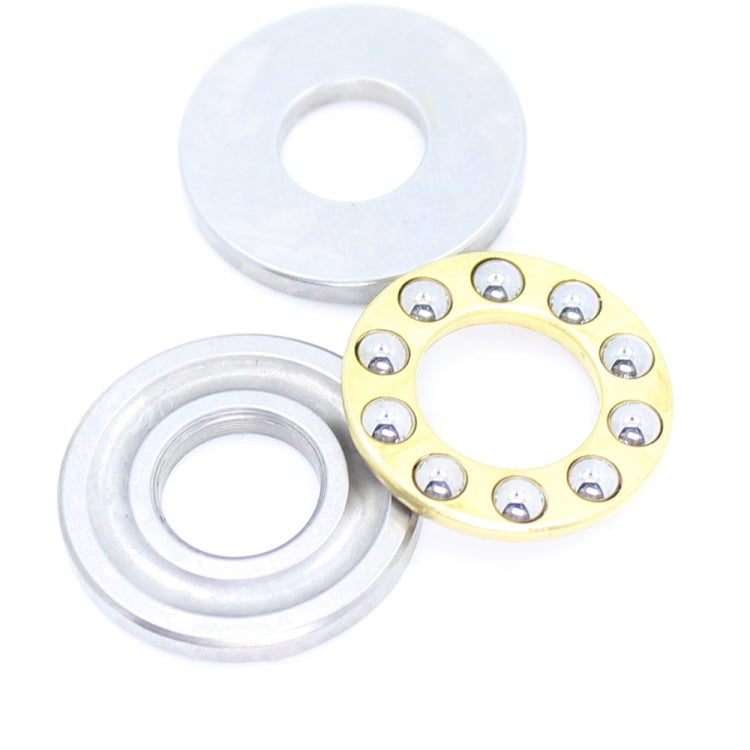 Thrust ball bearing set with two silver washers and gold ring, metal balls shown