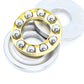 Thrust ball bearing close-up with gold ring, silver washers, and metal balls