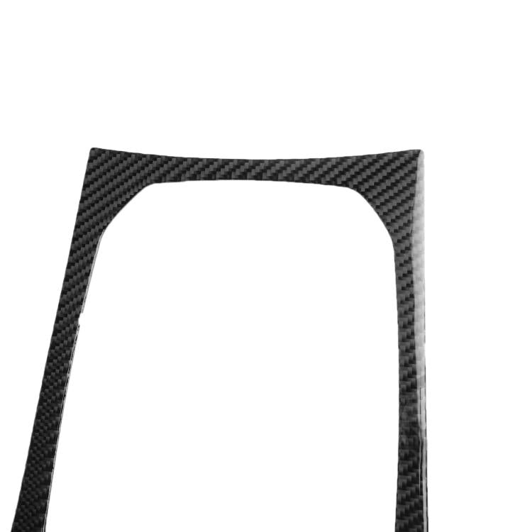 Close-up of black carbon-fiber style shift panel frame sticker with arched cutout