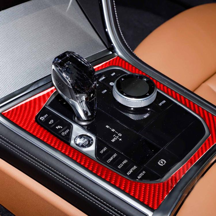 Central console shift area with red carbon-fiber style trim frame sticker