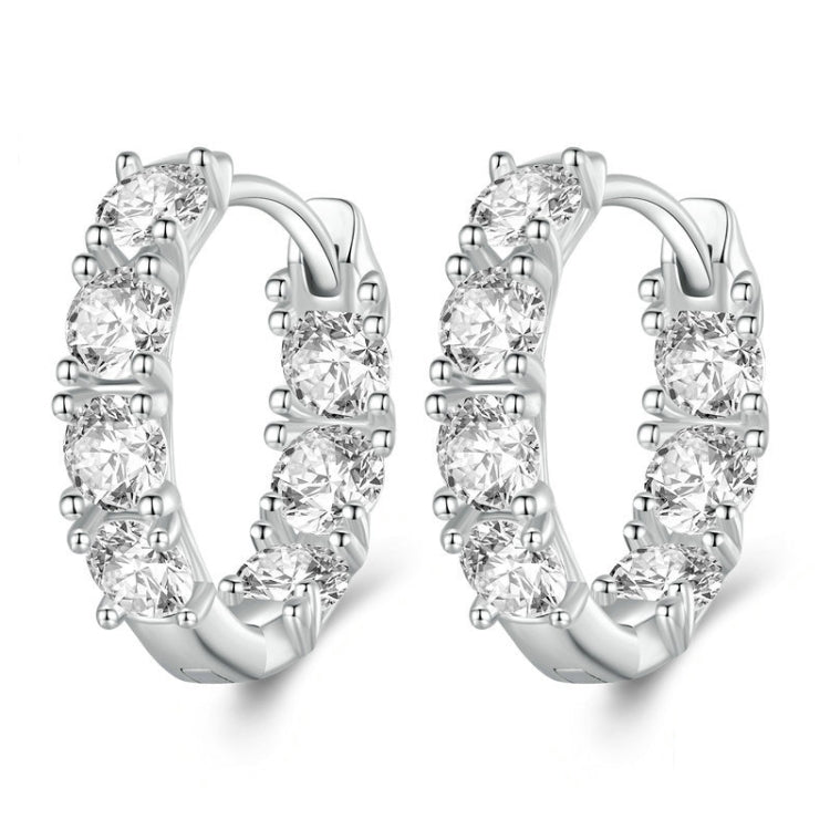 Silver hoop earrings with budding flower zirconia stones arranged along the band
