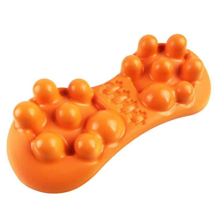 Orange acupressure massager with clustered round nubs and a textured center