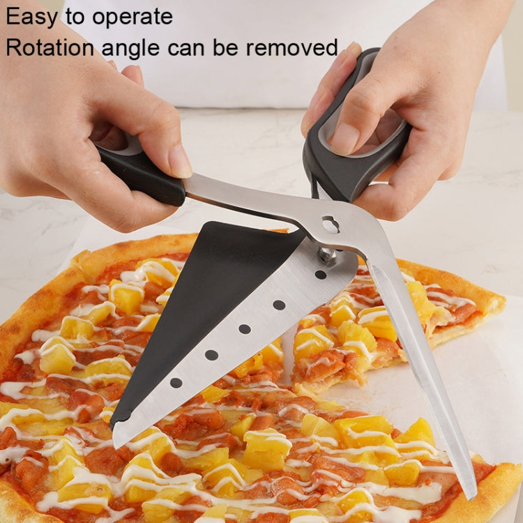 Pizza cutting scissors cutting a cheese-and-topping slice on a countertop