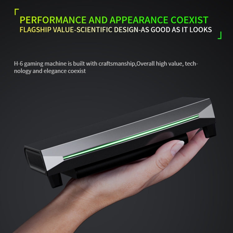 H6 gaming console with green LED stripe, shown being held by a hand