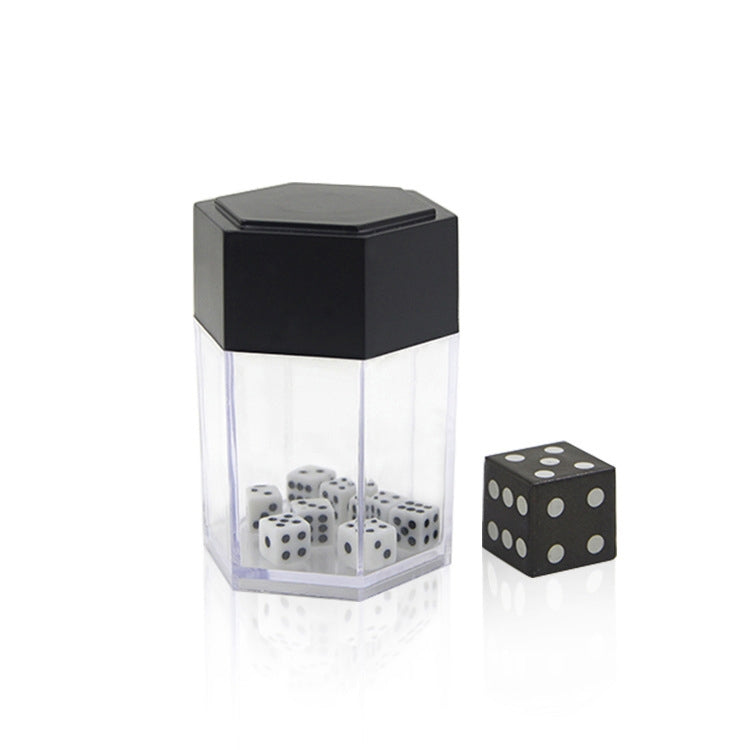 Black-lidded dice prop in clear plastic display with white dice and black die