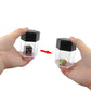 Hands holding black-lidded dice prop box with arrow showing the dice change