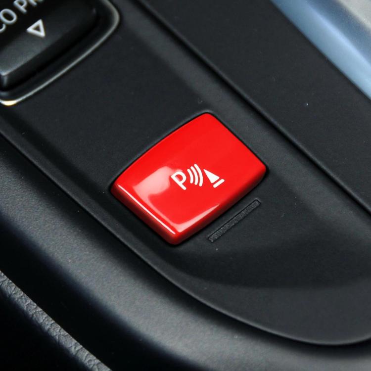 Red push-button with parking aid icon for gear sensor control
