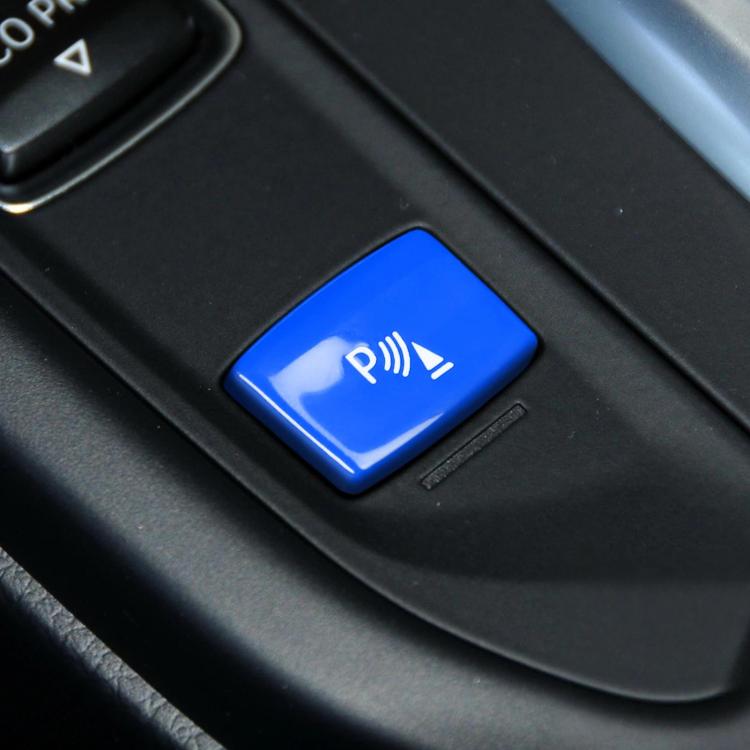 Blue push-button with parking aid icon for gear sensor control