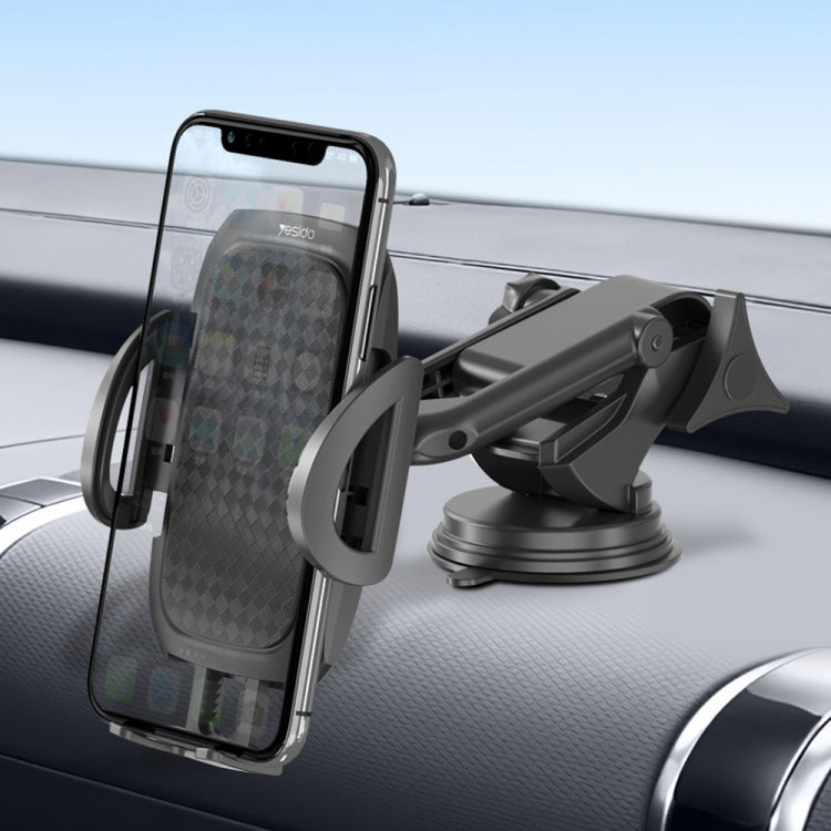Car dashboard phone mount with rotating cradle and telescopic arm attached