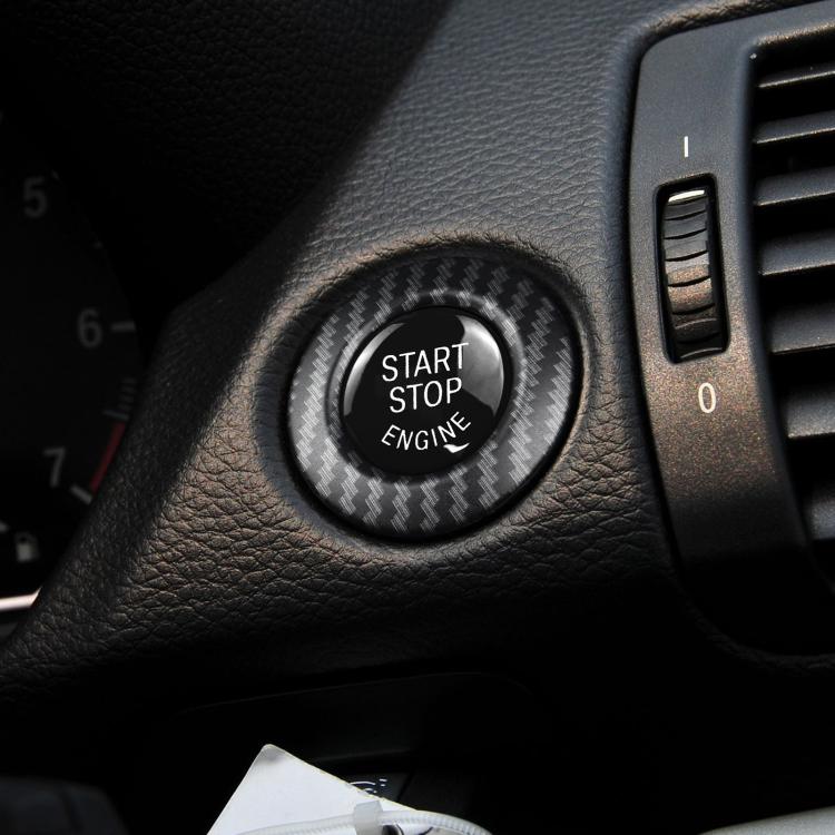 Carbon fiber start/stop engine button cover installed on car dashboard