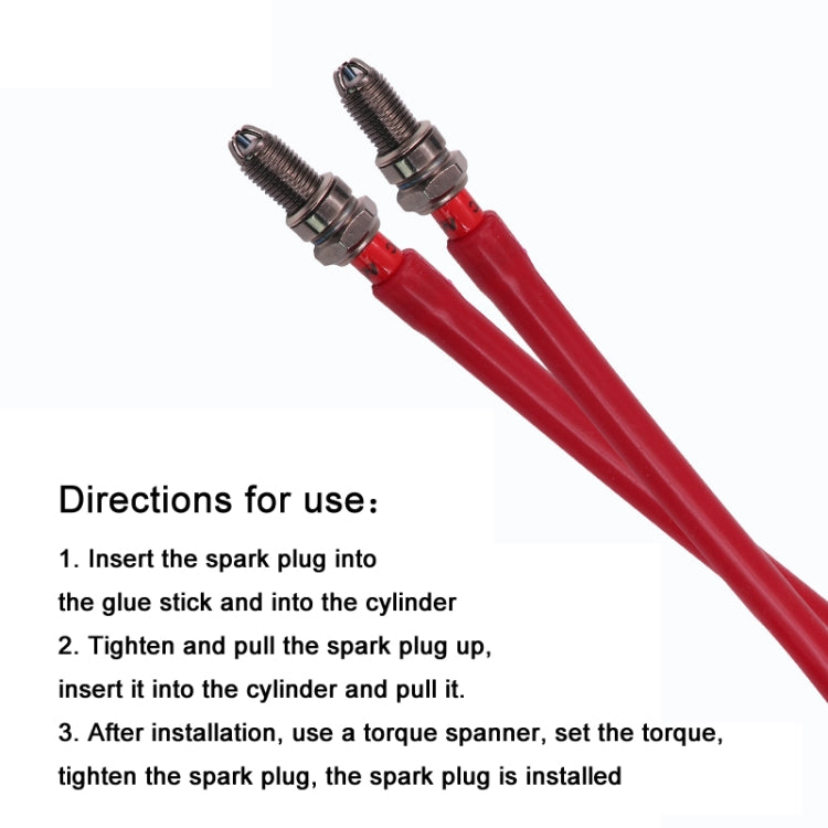 Set of red rubber spark plug installation tools with two metal threaded tips