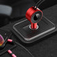 Red retractable dual USB car charger plugged into car console with built-in hubs