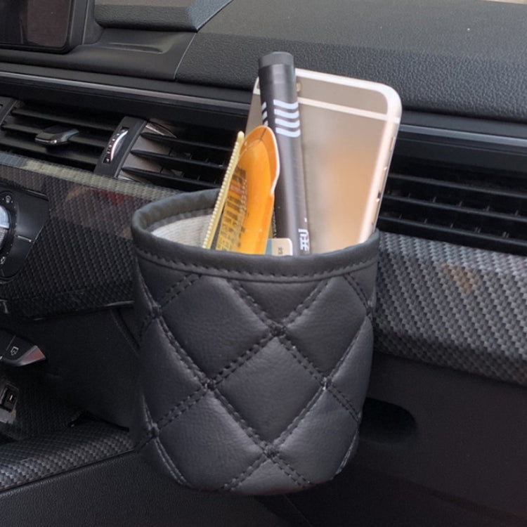 Black quilted car air vent hanging storage pouch with diamond stitching and snap top