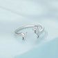 Sterling silver open dachshund ring featuring dachshund figures on the band