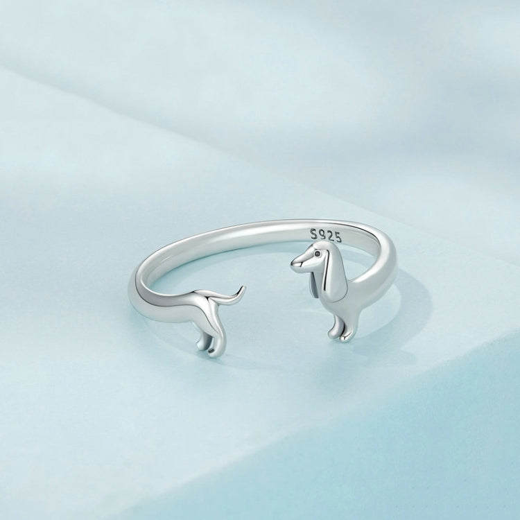 Sterling silver open dachshund ring featuring dachshund figures on the band