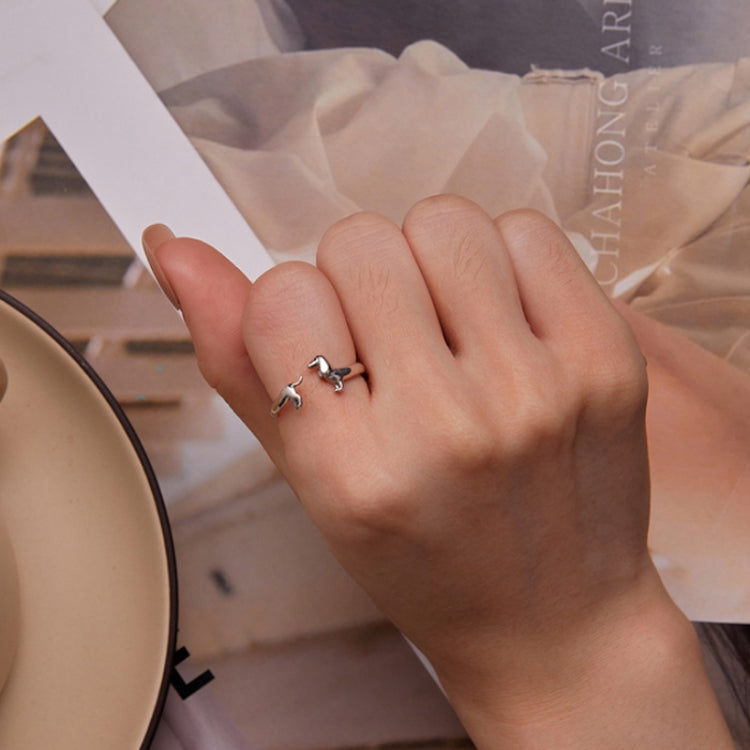 Sterling silver open dachshund ring worn on a finger