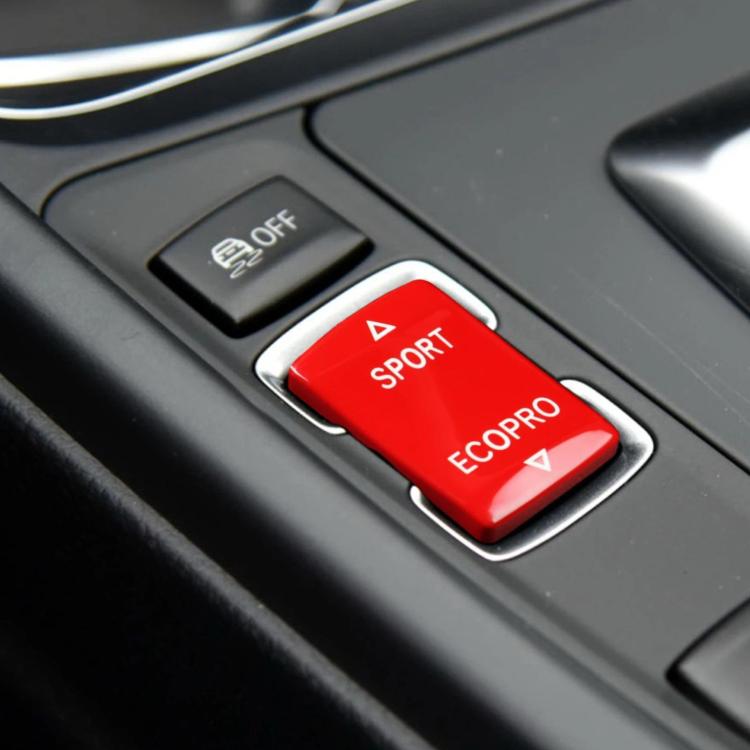Red SPORT/ECOPRO gear mode switch button for BMW F chassis, shown in center console