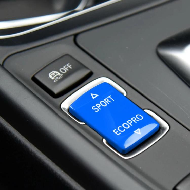 Blue gear mode switch button with SPORT and ECOPRO markings
