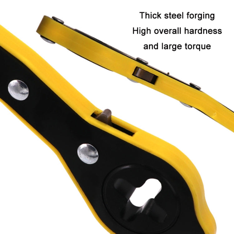 Close-up of yellow tire lug wrench handle and black grip section with metal slots