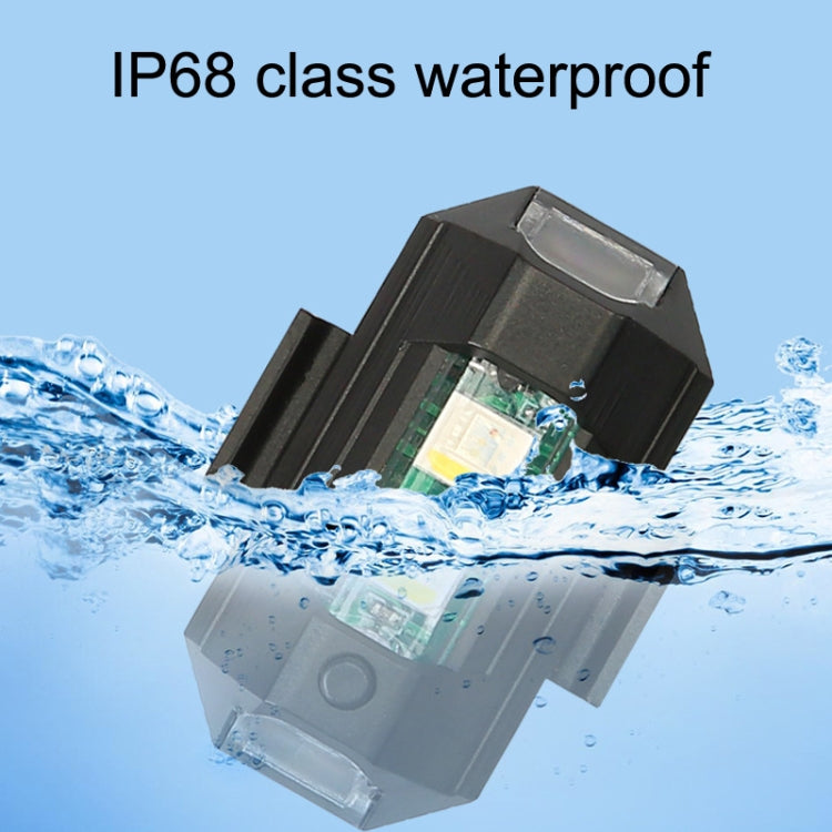 IP68 waterproof black LED rear light with clear lens, shown in water