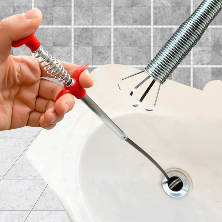 Handheld sewer dredge tool with red handle and spring four-claw gripper at drain