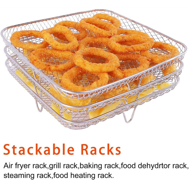Stackable air fryer wire rack holding golden dehydrated ring slices on the tray