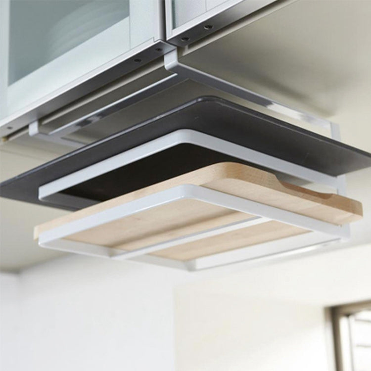 Close-up of black double-layer wall-mounted cutting board rack with two open trays