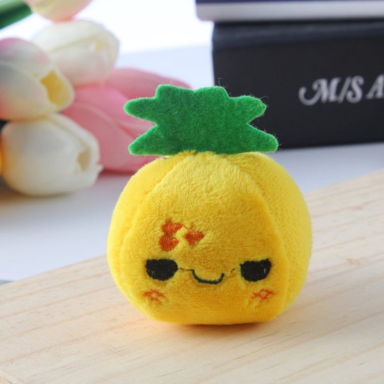 Yellow pineapple plush bag pendant keychain with smiling face and green top.