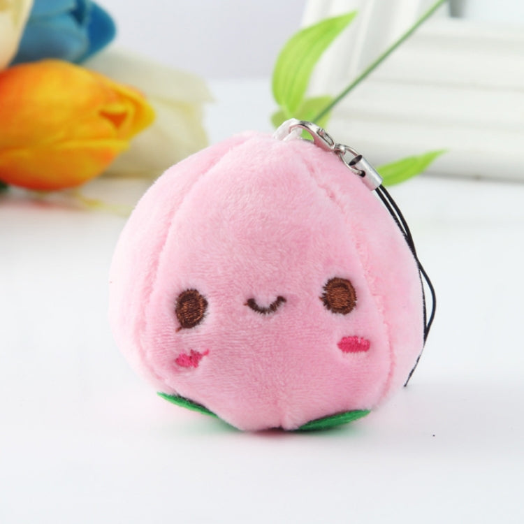 Pink fruit plush bag pendant keychain with smiling face and metal clip.