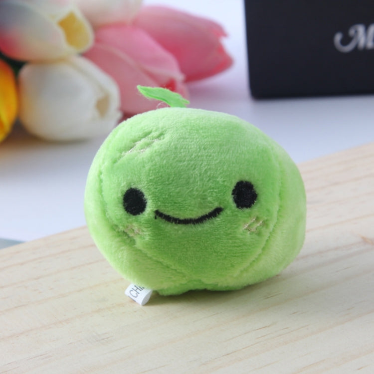 Green apple plush bag pendant keychain with smiling face and small tag.