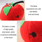 Close-up red strawberry plush bag pendant keychain with green leaf and loop.