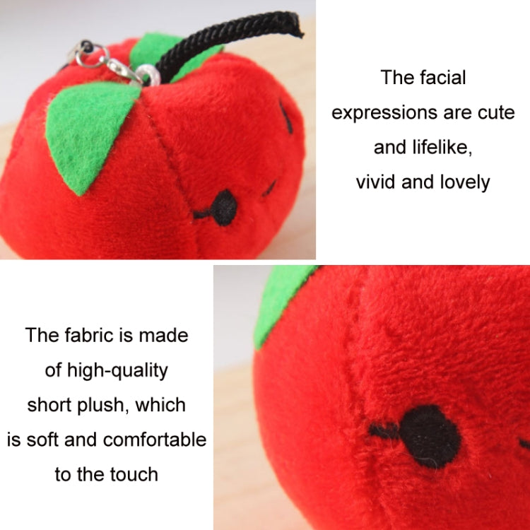 Close-up red strawberry plush bag pendant keychain with green leaf and loop.
