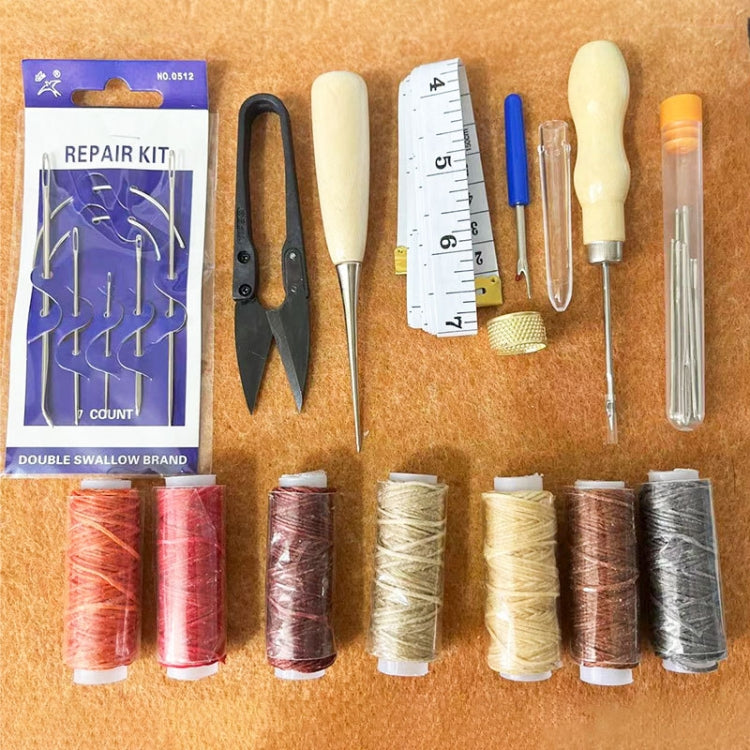 Leather repair sewing kit with needles, thread, snips, and measuring ruler on board