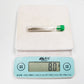 Stainless steel embroidery needle in clear storage tube with green cap