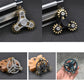 Four-gear fidget spinner showing silver and black versions from multiple angles.