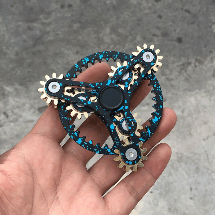 Blue-rim four-gear fidget spinner with gold-tone gears and dark central disc.