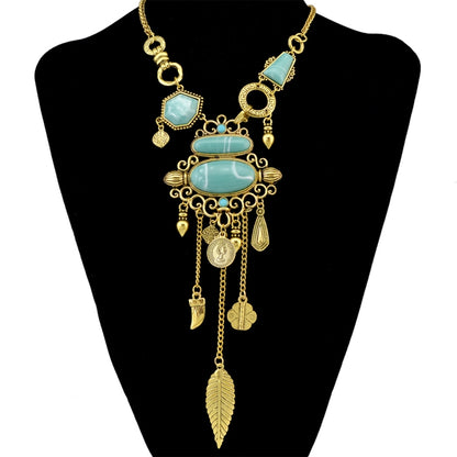 Gold-tone openwork necklace with turquoise stone accents and dangling leaf charms