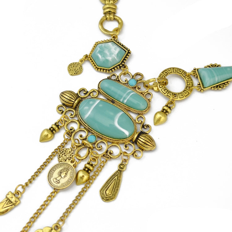 Gold-tone close-up necklace with turquoise cabochon links and dangling coin/leaf charms