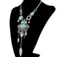 Silver-tone openwork necklace with turquoise oval stones and long dangling leaf charm