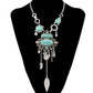 Silver-tone turquoise statement necklace with ornate openwork bib and leaf tassel drops