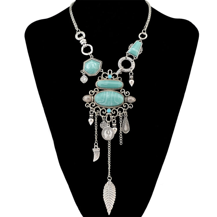 Silver-tone turquoise statement necklace with ornate openwork bib and leaf tassel drops