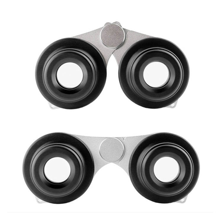 Black binoculars front view with two round eyepieces and silver center hinge
